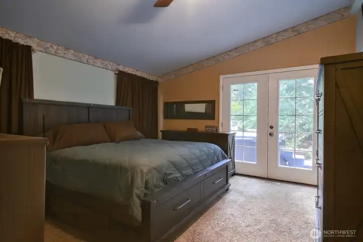 PRIMARY BEDROOM FRENCH DOORS OUT TO DECK AND HOTUB