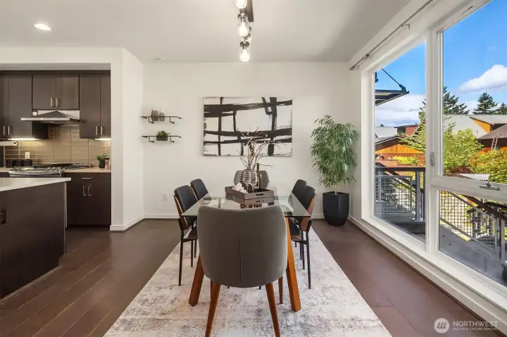 Dining area flowing seamlessly into kitchen and open living space. Dining area flowing seamlessly into kitchen and open living space.