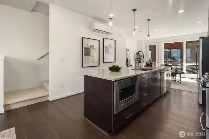 Kitchen with seamless flow between living spaces. Kitchen with seamless flow between living spaces.
