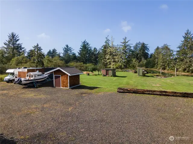 Outbuildings include well house , outdoor kitchen, restroom. Plenty of space for boats, RVs and there is a fence obscured yard for heavy equipment, toys etc. etc.