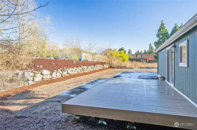 A beautifully terraced backyard with ample space for recreation and relaxation. Back yard was newly seeded for a lush lawn in the Spring