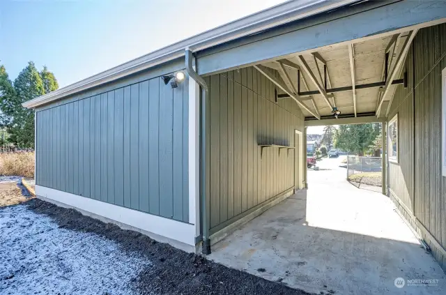 A convenient covered breezeway seamlessly connects the main home to the spacious two-car garage.