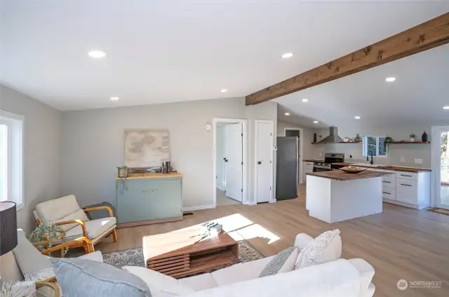 Admire the aesthetic appeal of the wood wrapped beam which matches the kitchen countertops.