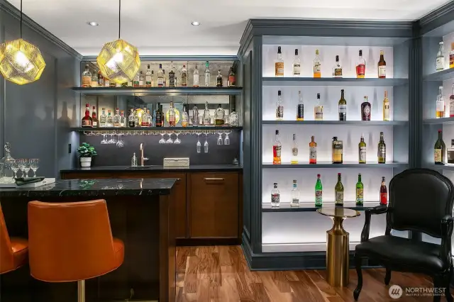 Tucked discreetly on Level 1, the Speakeasy dazzles with jewel-toned lacquer, glowing bottle displays, and an inviting bar for two. A nod to clandestine glamour and intimate revelry—perfect for a nightcap, a secret toast, or tales best told off the record.