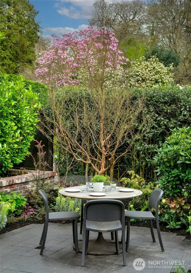 Tucked within the Grilling Terrace, this intimate Outdoor Dining area is a private pocket of calm framed by flowering trees and manicured hedges. Whether for morning coffee or twilight suppers, it offers a lush backdrop for everyday rituals made extraordinary.