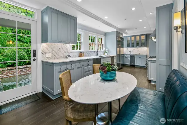 A chef’s domain with soul and sophistication. This reimagined Kitchen flows through zones of culinary function and conviviality—anchored by a custom leather Banquette and rounded marble table. Wrapped in soft slate hues with brass accents, the space feels simultaneously serene and alive.