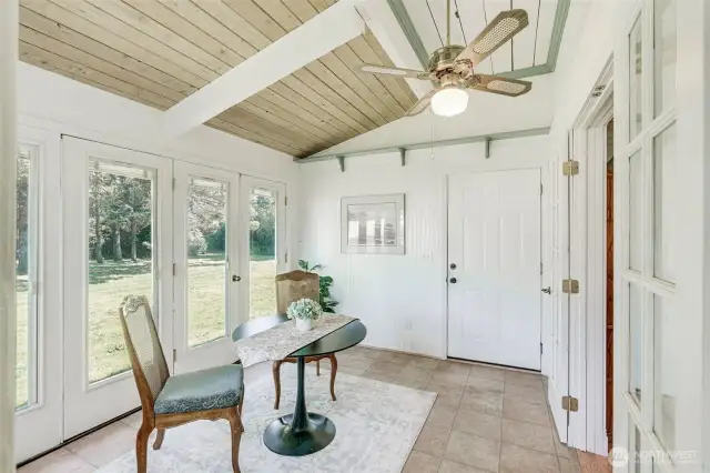 Off the kitchen is a great sun room and dining space!