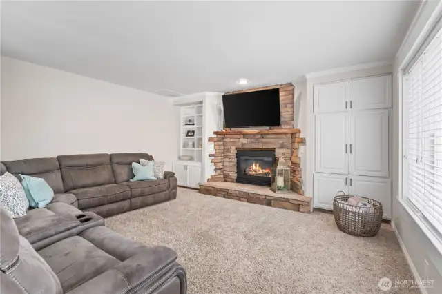Great room off of kitchen with built ins and views of the golf course