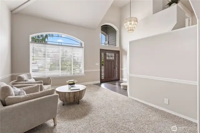 Formal living room with huge windows to let the light flood in