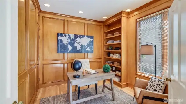 A cozy den ideal for a home office or reading nook on the main floor.