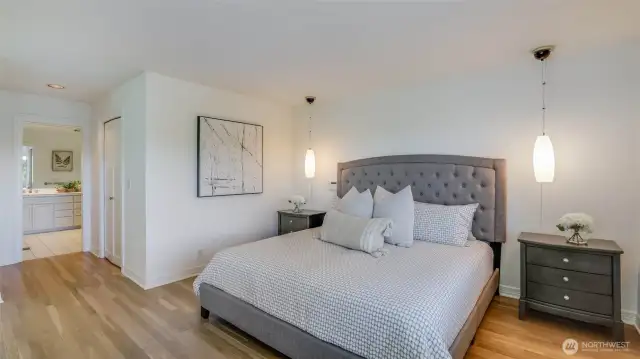 Upstairs, the serene primary suite offers a sitting area, spa-inspired bath, and walk-in closet.