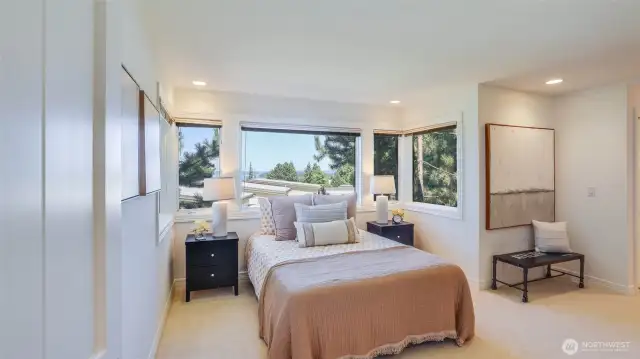 A second upstairs bedroom with its own full ensuite bath is perfect for guests or additional family. Enjoys peaceful lake view.