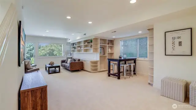 The lower level provides exceptional versatility with a third bedroom, full bath, and a dramatic bonus room.