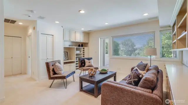 Just outside, a secluded patio provides the perfect outdoor hideaway for peaceful mornings or evening gatherings.