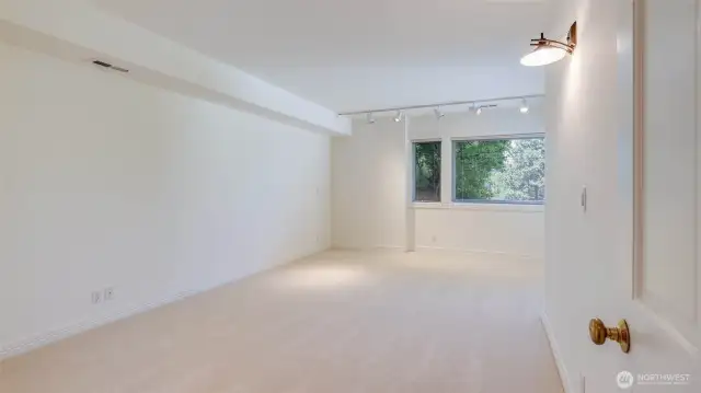 Large third bedroom with walk-in closet and full bathroom nearby.