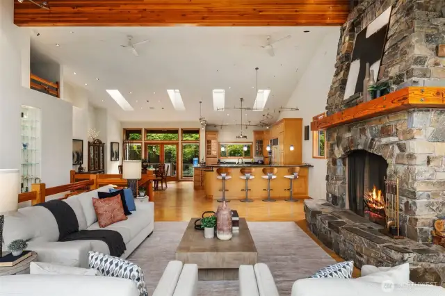 Enjoy this light filled main level with plenty of room to spread out, or be cozy by your combo gas/wood burning firepit. Skylights and higher windows fill this space with light even on the darkest of NW days.