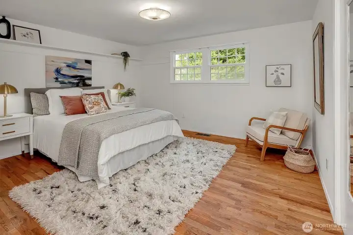 Primary bedroom with built-in ceiling shelves.