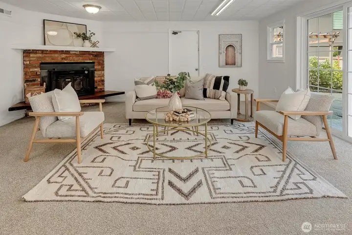 The basement provides a versatile great room with new carpet.