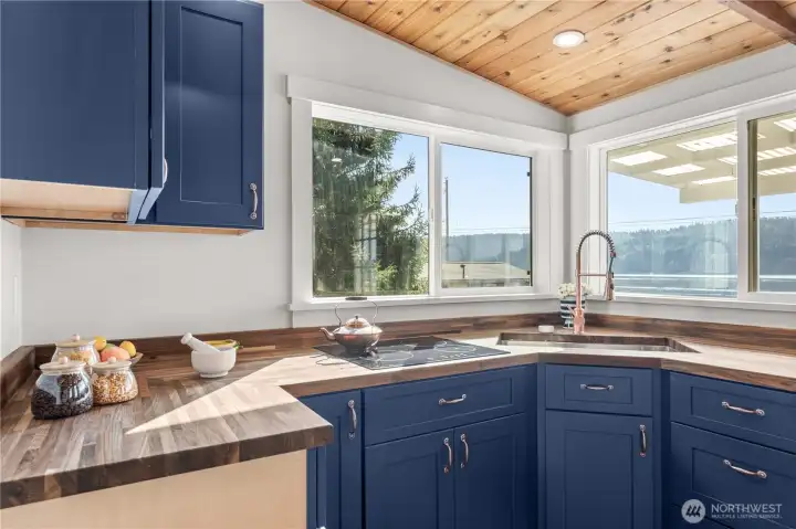 Cute kitchen space with nice cooktop and plenty of cabinet space.