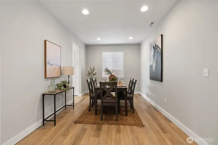 Elegant Dining Room – Bright and welcoming with wood-style floors and recessed lighting, this formal dining space is perfect for family dinners or entertaining guests.