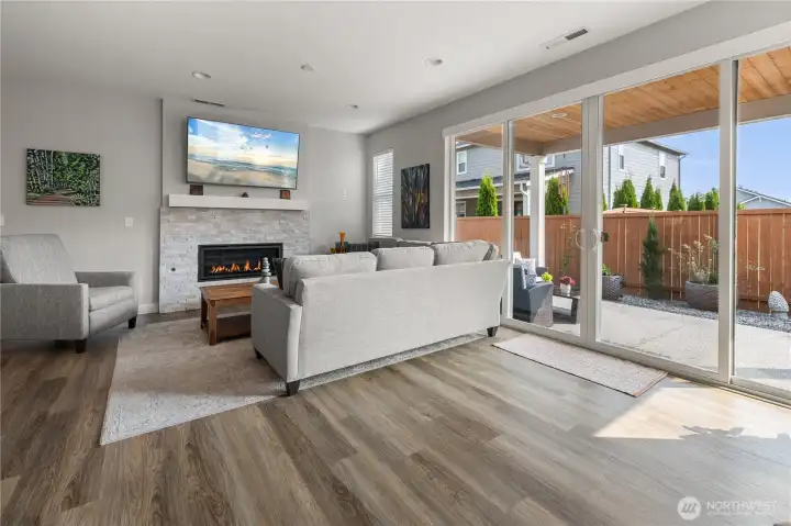 Indoor-Outdoor Living – Expansive sliding glass doors fill the great room with natural light and open to the covered patio and fully fenced backyard, ideal for entertaining or relaxing year-round.
