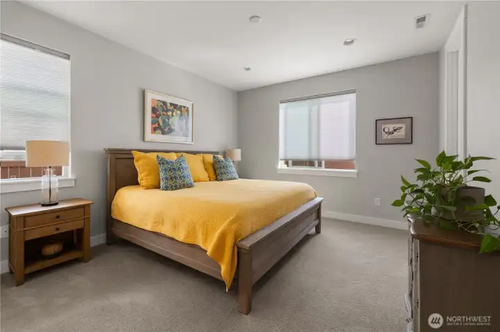 Spacious Primary Suite – Peaceful retreat with plush carpet, generous natural light, and ample room for a king bed and additional furnishings.