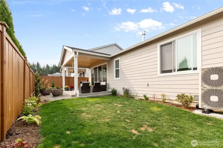 Private Backyard with Covered Patio – Fully fenced yard with easy-care landscaping and a covered patio, ideal for outdoor dining, gardening, or relaxing year-round.
