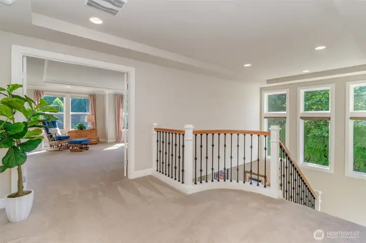 Spacious landing & abundant windows.