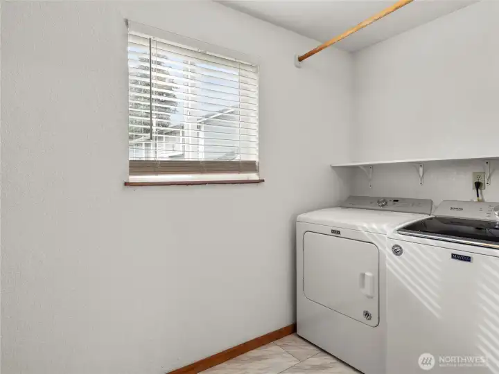 Laundry room with extra storage. Washer/Dryer stay.