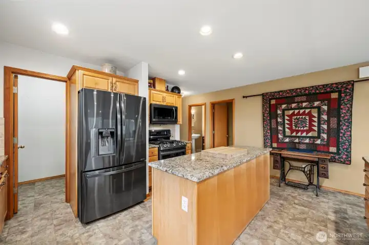 Gas stove, island with power and walk-in Pantry.