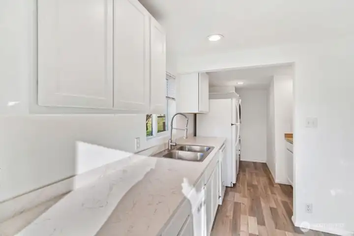 Washer/dryer in kitchen. Bump out back wall for 2nd bdrm