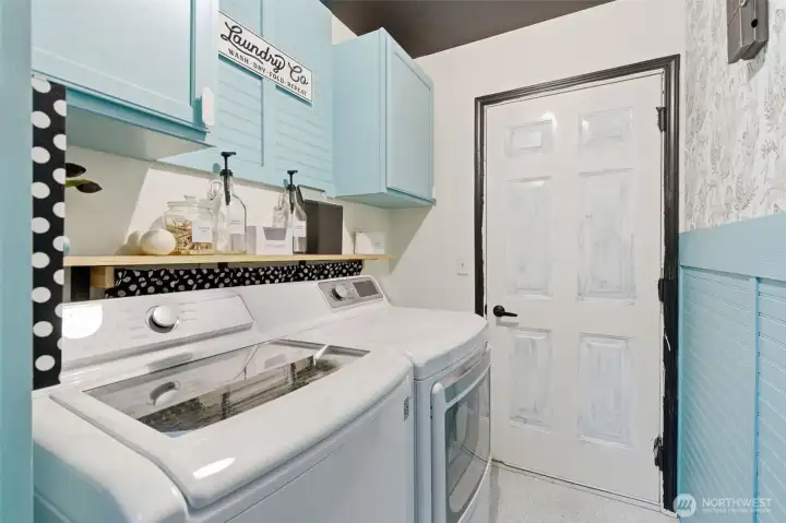 Designated laundry room leads to garage