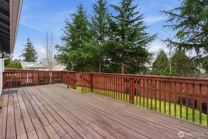 Walk out the back door to your back deck and fully fenced yard