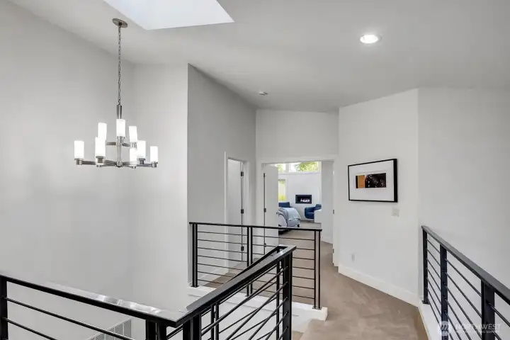 This home welcomes you with a soaring two-story entry with skylight.