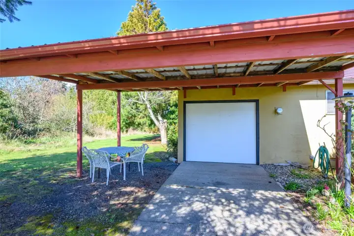 Carport and door to 3-car garage