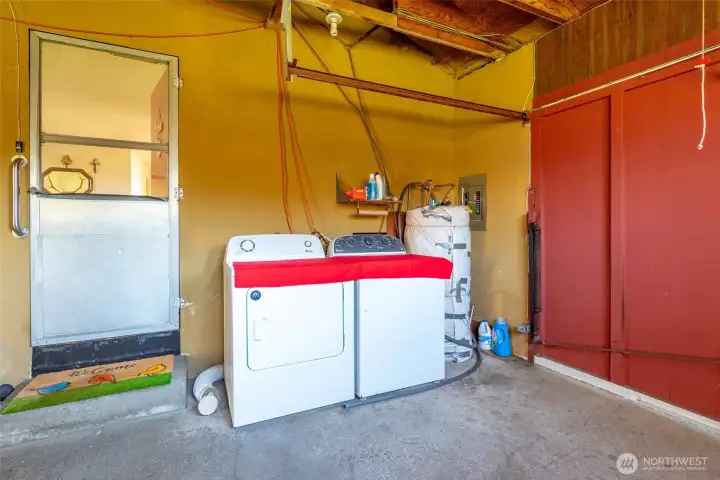 Laundry in attached 3-car garage with door into living room