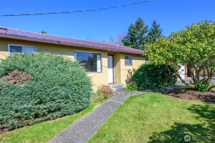 Sidewalk from carport to front door.