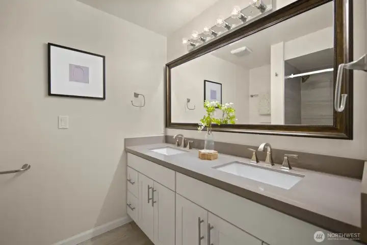 Main floor shared bath with dual vanity.
