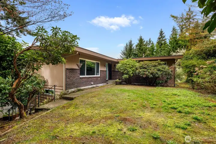 Unassuming front entry, but the home opens up when you walk in the front door