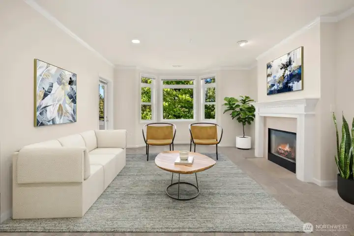 Shining with a light contemporary color palette and new carpet, the living room features bay windows, gas fireplace and access to covered deck. Virtually Staged Shining with a light contemporary color palette and new carpet, the living room features bay windows, gas fireplace and access to covered deck. Virtually Staged