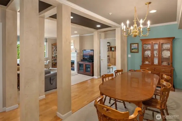 From the foyer, through the dining area, this picture shows the entry through French doors to the great room and kitchen.