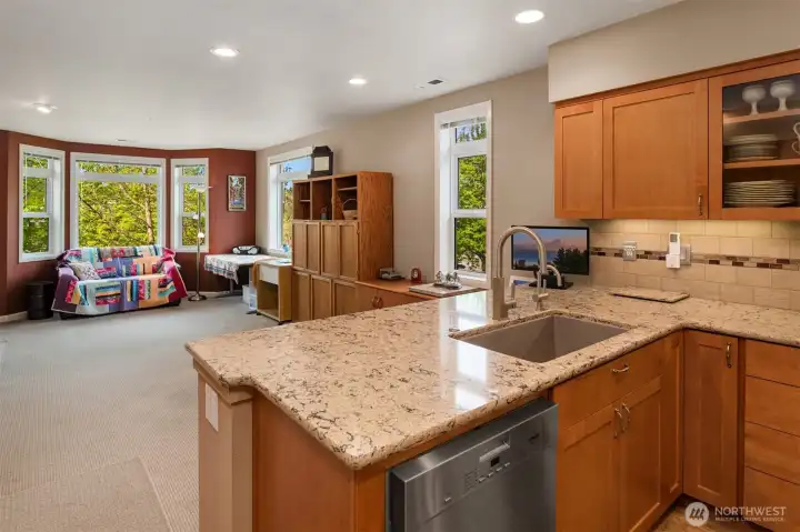 Kitchen to Great Room - This is another large gathering space with bay windows looking out to leafy city and territorial views.  This space can be closed off from the rest of the home for sound control and temperature regulation.