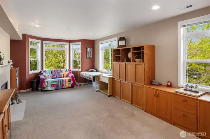 This room is expansive and bright.  (Cabinets make it appear smaller in this picture, but are not built-in.)