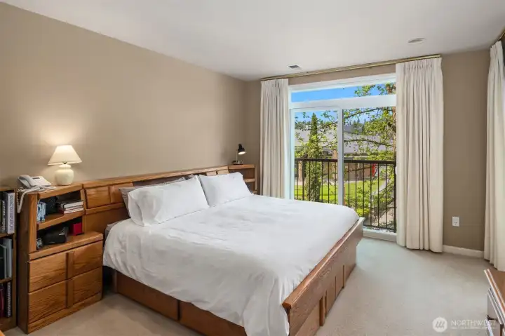 Primary Bedroom Features Slider with Clerestory Window Offering Expansive Views and Generous Light