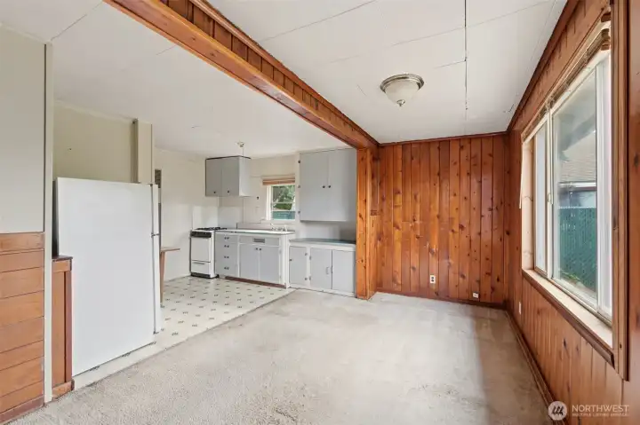 Enter to find the cozy living room and adjoining kitchen. Enter to find the cozy living room and adjoining kitchen.