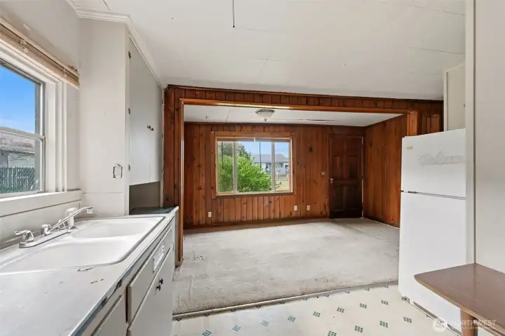 This photo shows the kitchen looking out towards the living room. This photo shows the kitchen looking out towards the living room.