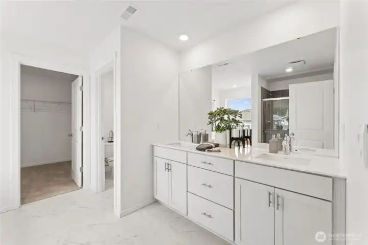 Primary bathroom features quartz countertops, soft close cabinets, and cabinets pulls. Primary bathroom features quartz countertops, soft close cabinets, and cabinets pulls.