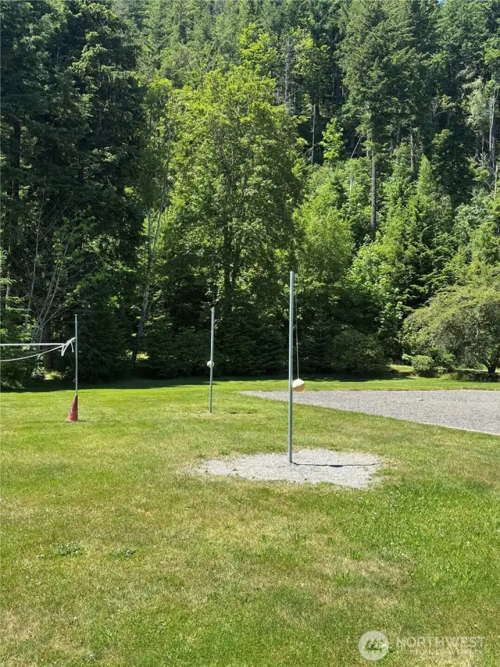 Tether ball and volleyball nets. Frisby area as well.