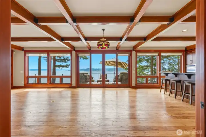 Open concept living featuring a wall of windows that open up to stunning views of Saratoga passage