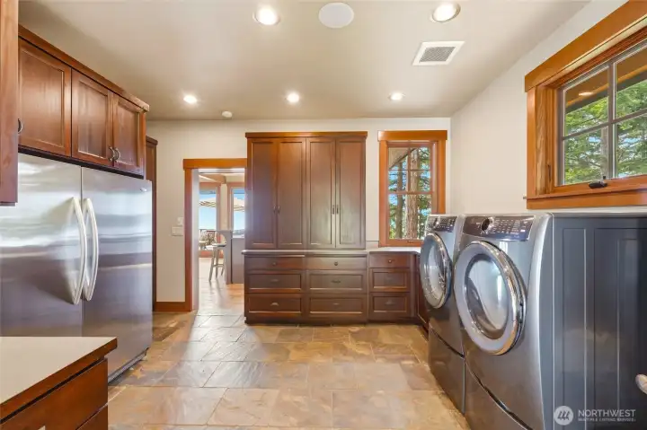 Laundry/mudroom with large butler fridge and plenty of pantry space